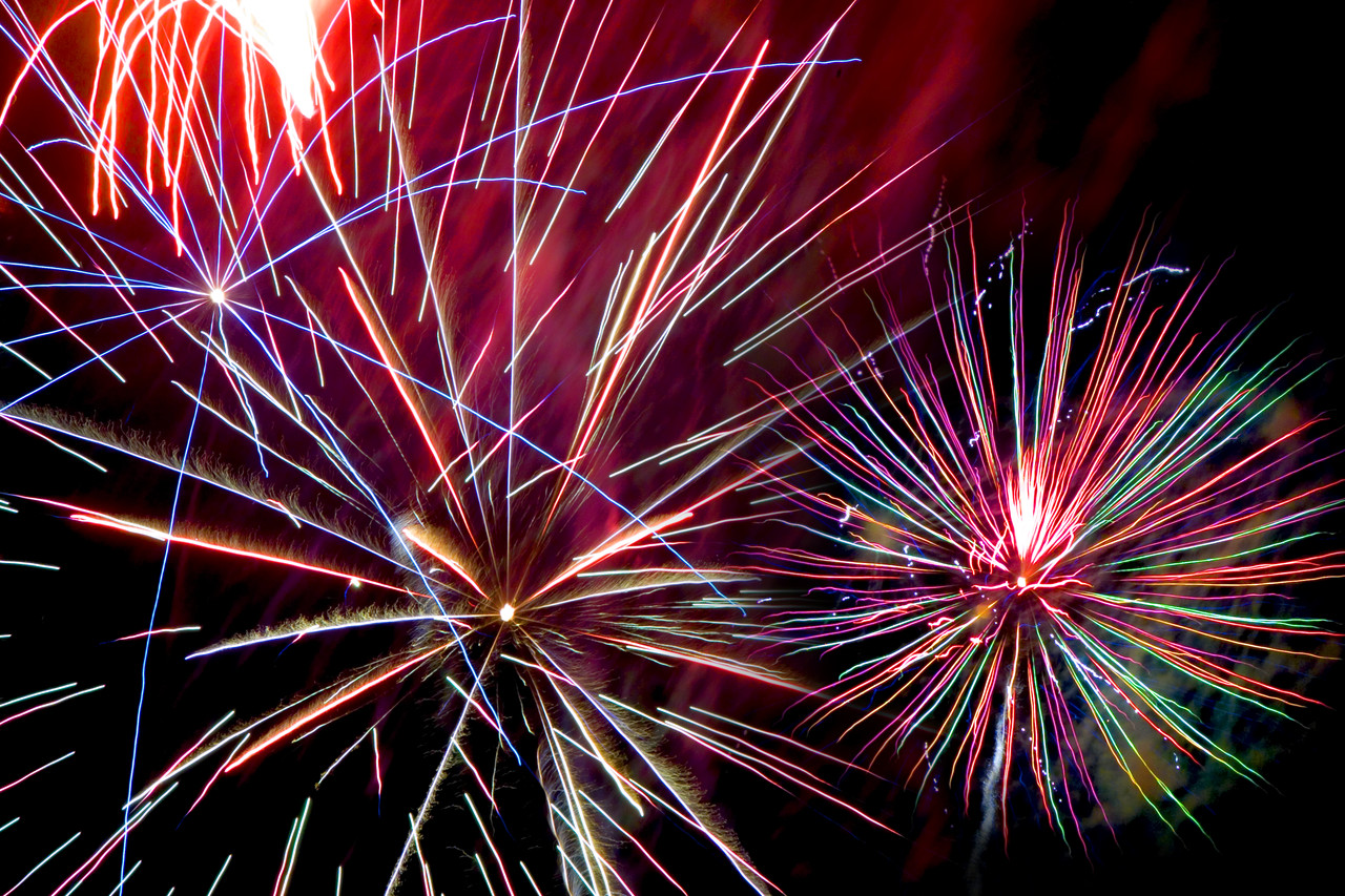 Colorful fireworks exploding in the sky.